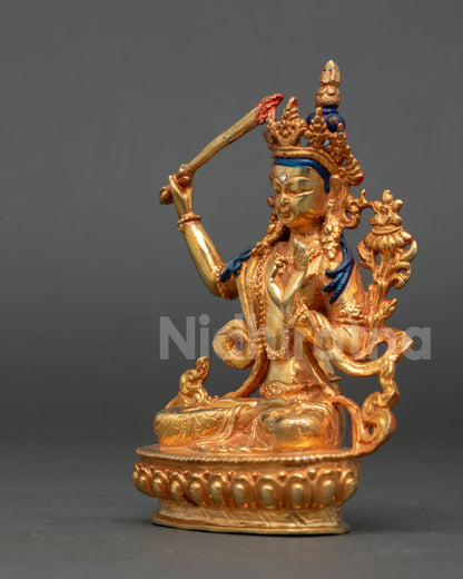 left view of handmade manjushri buddhist statue with utpala flower