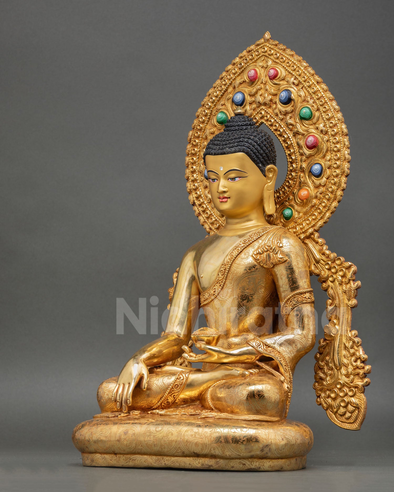 left view of Himalayan Shakyamuni Buddha sculpture with detailed fire-gilding