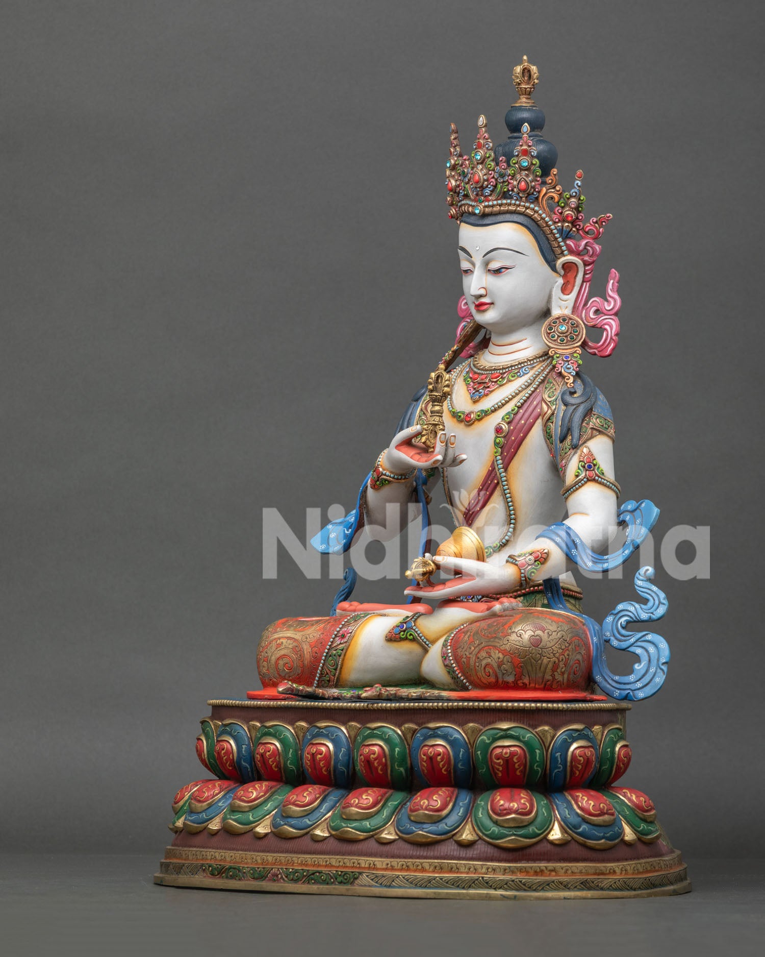 left view of vajrasattva copper statue with gold gilded details from nepal