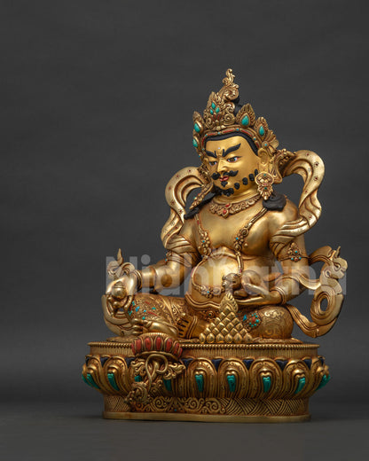 left view side of 24k gold fire-gilded dzambhala statue made by newari artisans