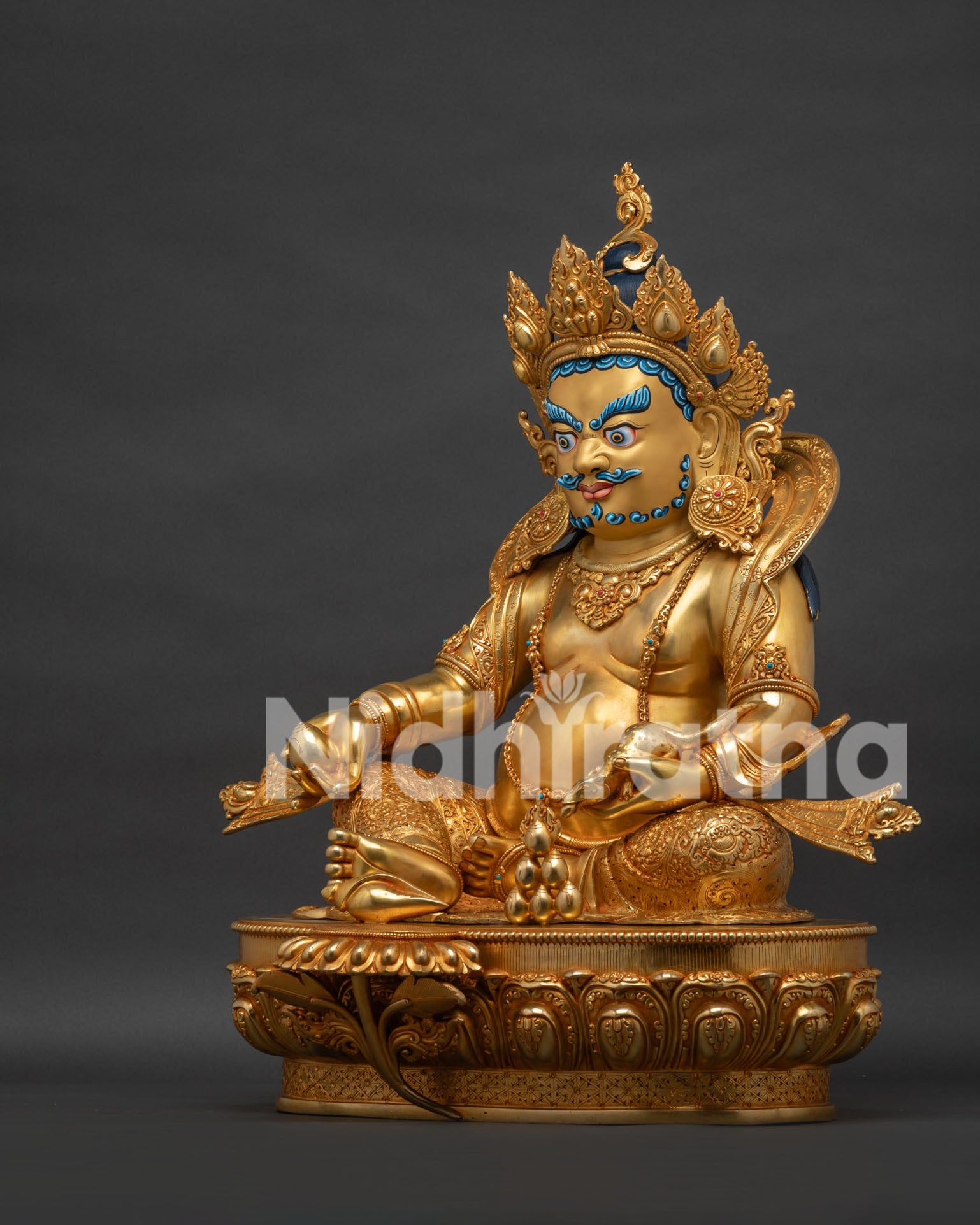 Left view side of Dzambhala statue featuring lotus throne and handcrafted Newari artistry