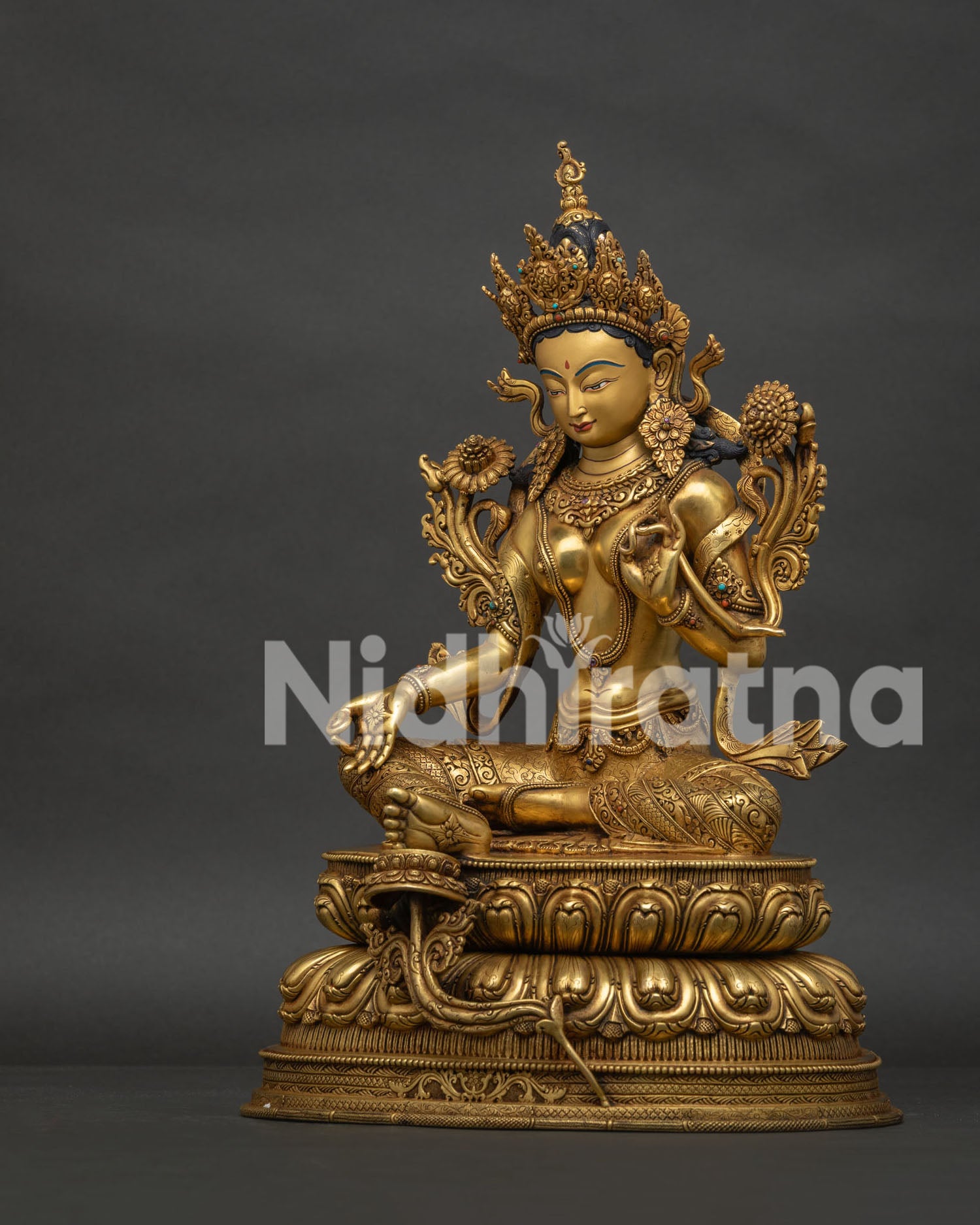Left view side of Green Tara statue with copper carvings and gold fire gilding