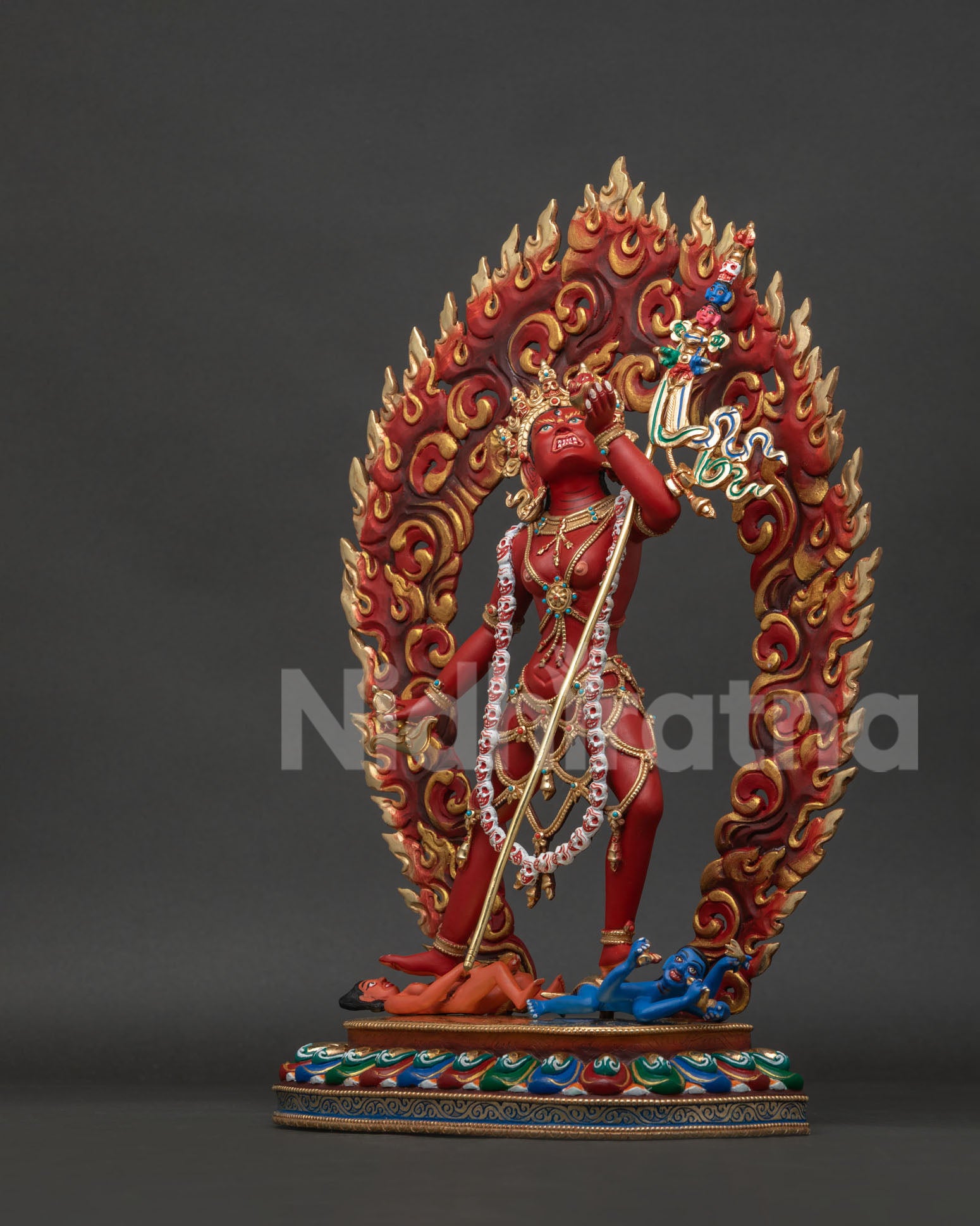Left view side of Vajrayogini Buddhist sculpture with skull cup and lotus pedestal