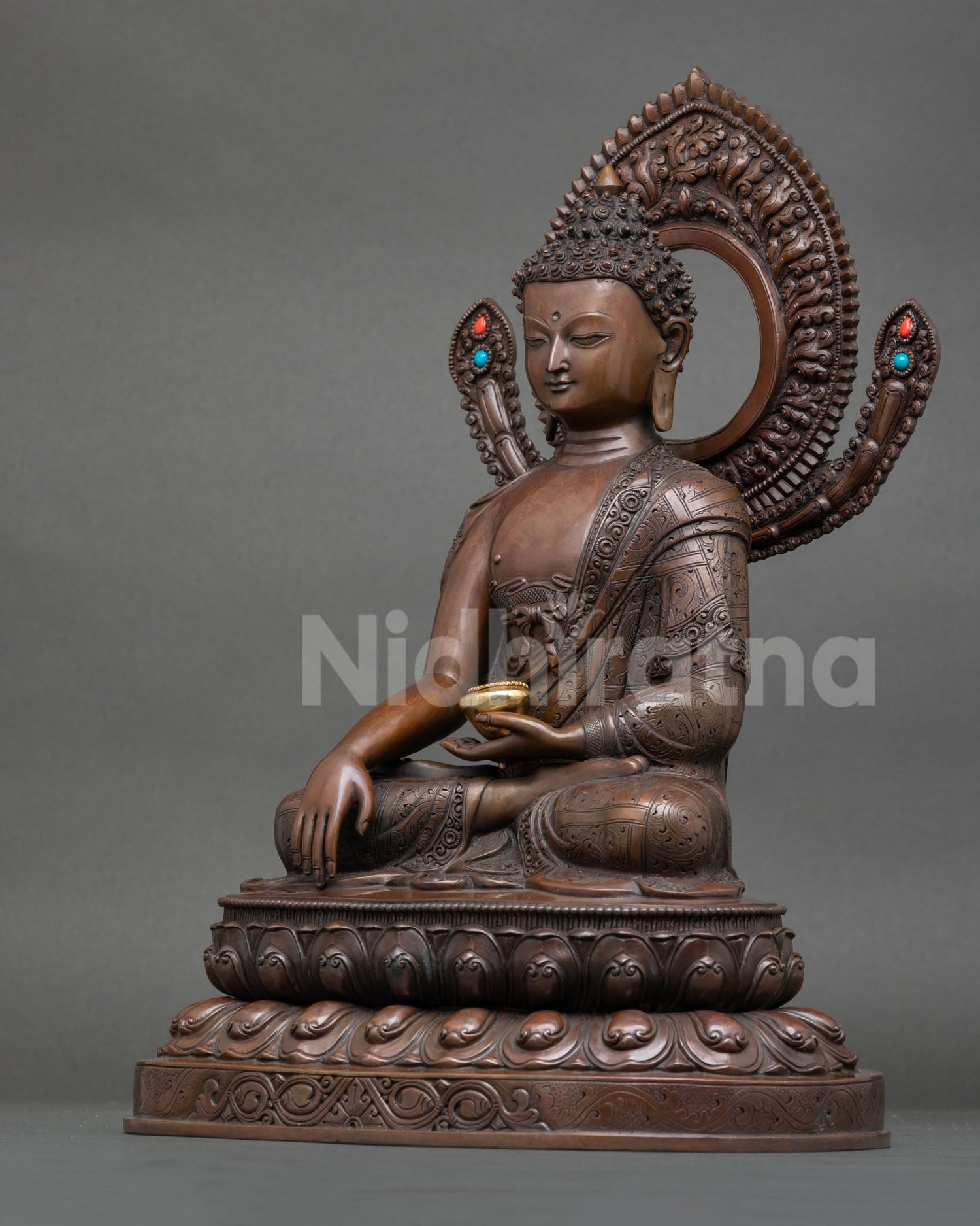 left view side shakyamuni buddha statue oxidized copper robe folds nepali craftsmanship detail
