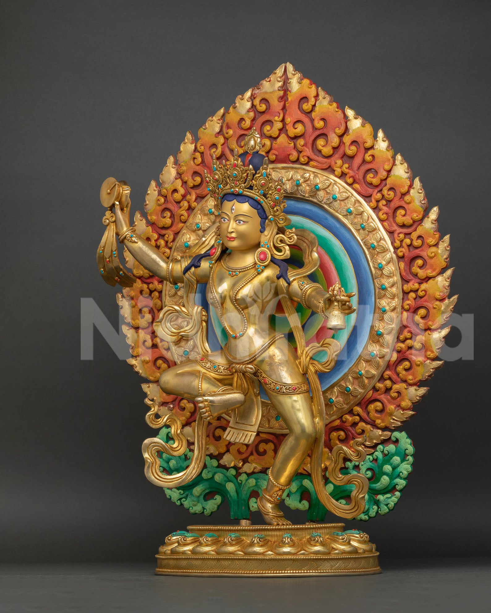 left view side, left profile view of machig labdron copper statue with bell, flowing robes and detailed gold gilded craftsmanship