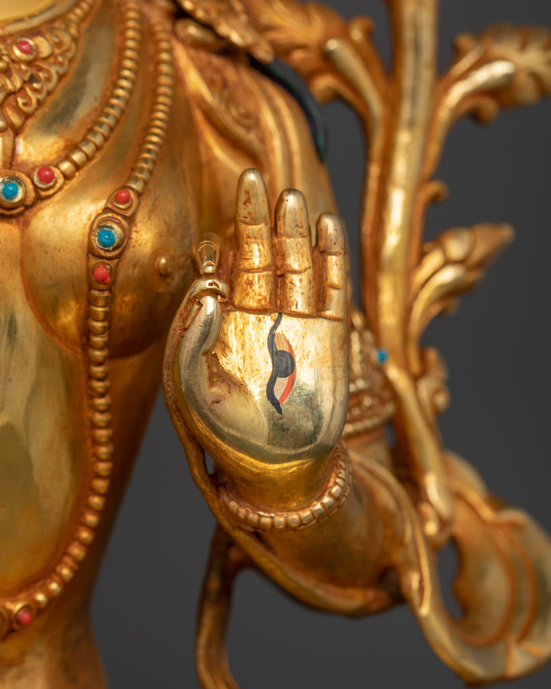 left palm with eyes of gold plated white tara statue