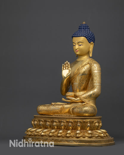 left view side amoghasiddhi buddha statue monk robe floral designs and polished finish
