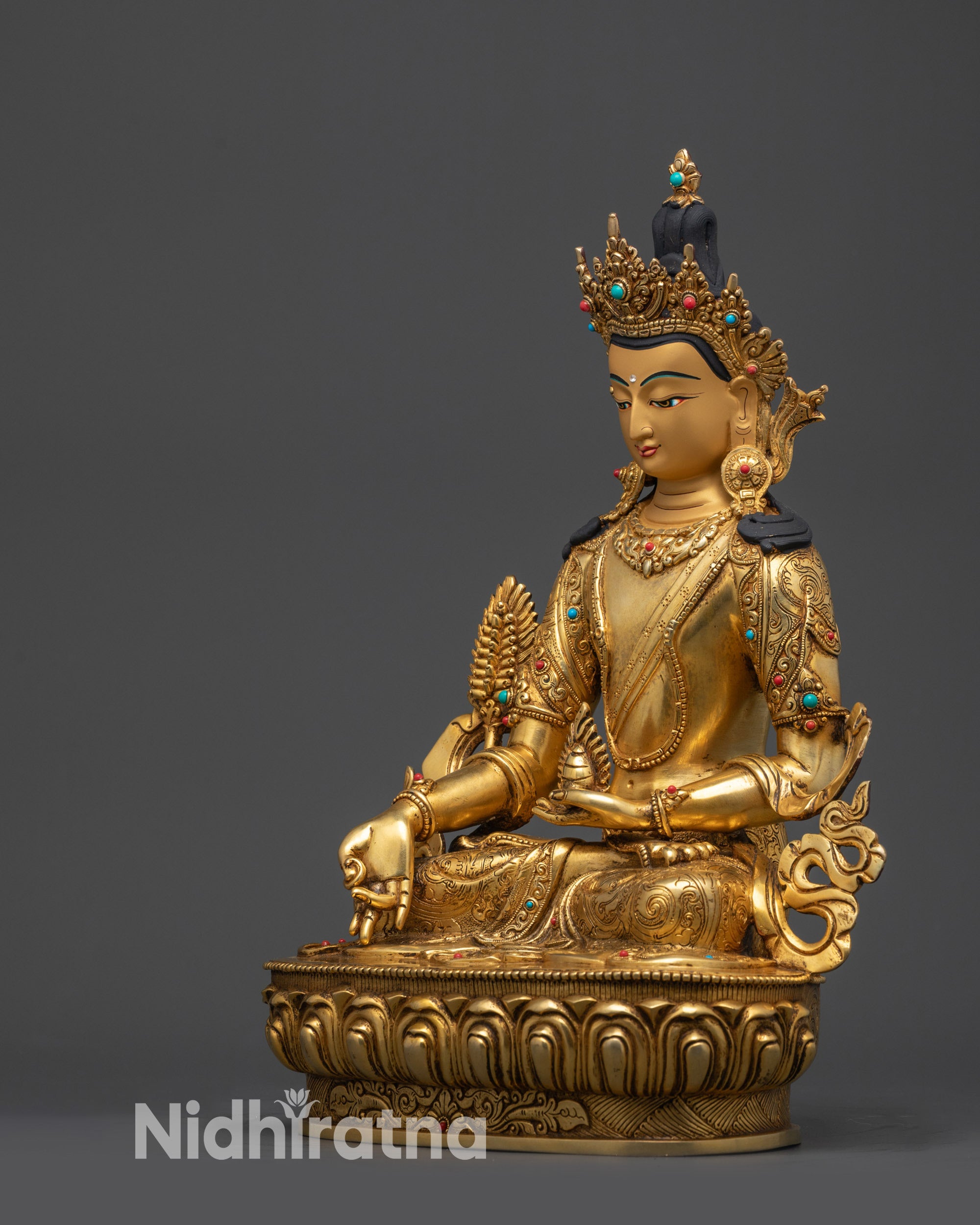 left view side kshitigarbha statue lotus pose and intricate jewelry details
