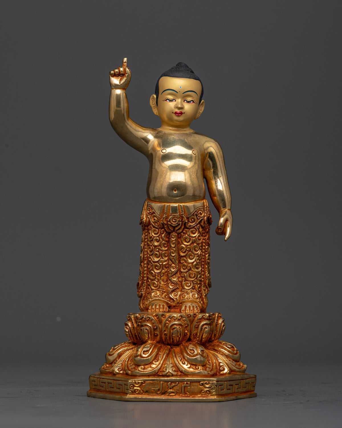 Little Shakyamuni Buddha Statue with hand carved floral motifs on richly adorned lower garment.