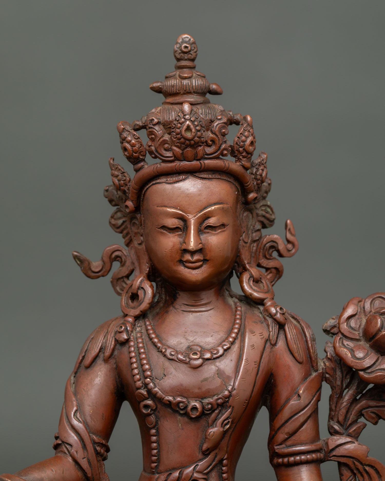 lokeshvara bodhisattva statue close-up showing lotus seat, ornaments and handcrafted details
