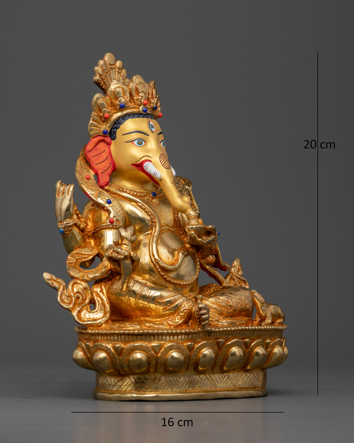 Lord Ganesh idol seated on a lotus pedestal with four arms and traditional Nepalese craftsmanship