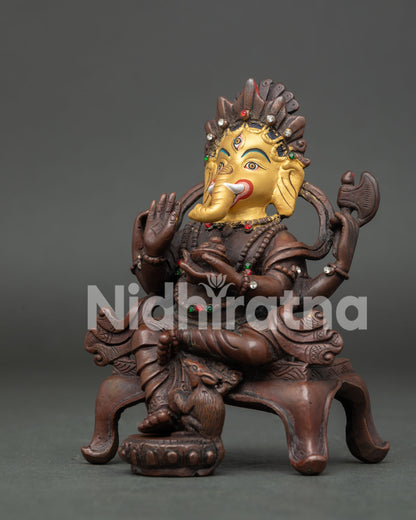 Lord Ganesh Statue with Ornate Crown and Four Arms.