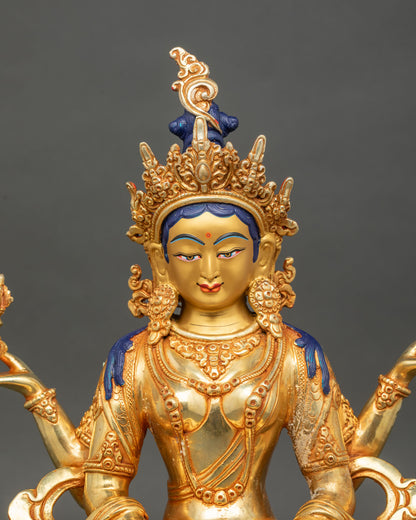 Close up Prajnaparamita head and four arms holding sutra and vajra detailed carving