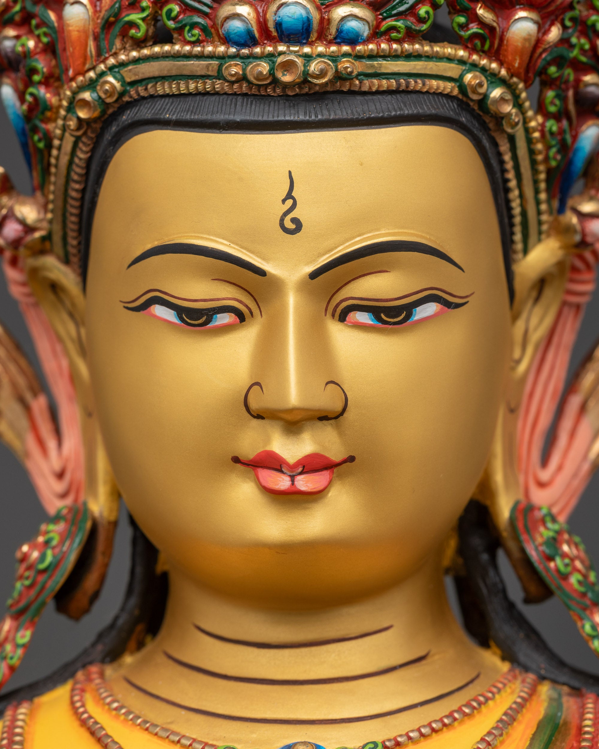 lose-up 24K gold gilded Mitrugpa Buddha face serene expression Himalayan craftsmanship