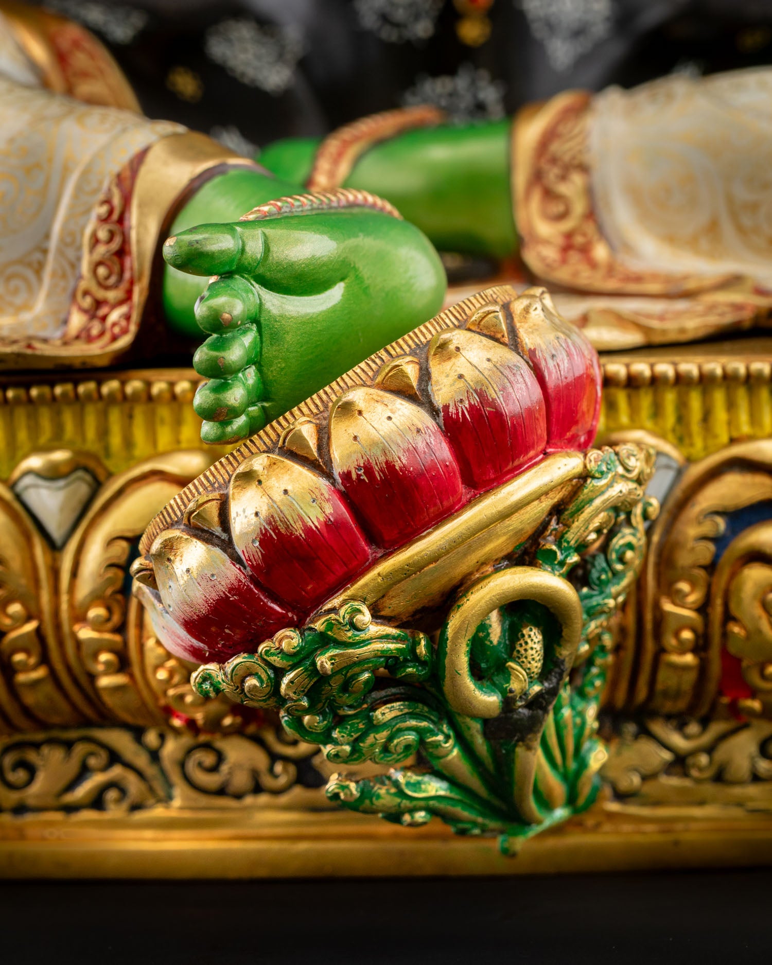 Lotus pedestal detail with vibrant acrylic colors supporting Green Tara Statue