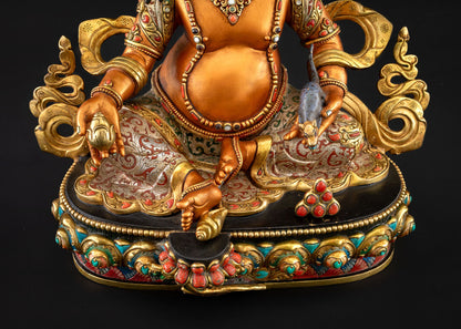 Lower front view of Yellow Dzambhala statue and lotus seat