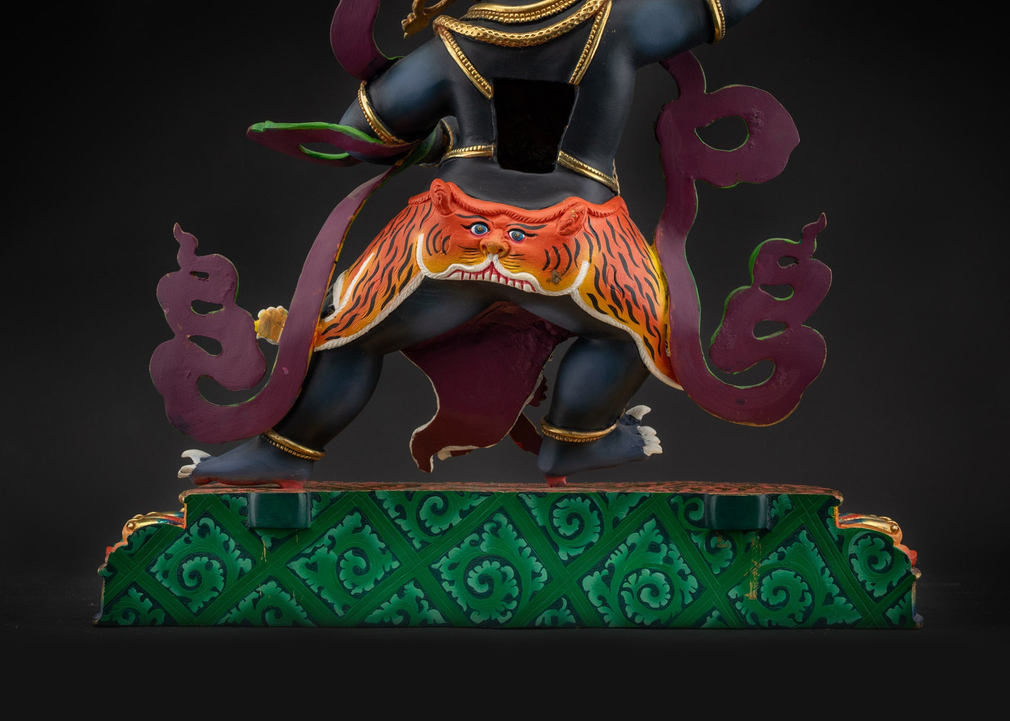 lower landscape back Vajrapani statue back view showing halo and decorative details