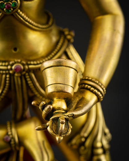 Machig Labdrön close up view of ritual bell held in the left hand, finely detailed sacred ghanta symbolizing wisdom, compassion.