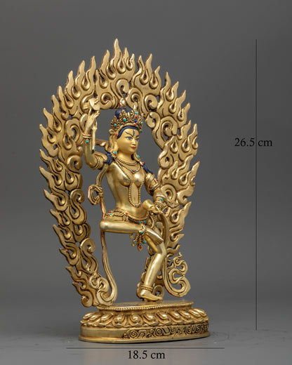 Machig Labdron Buddhist statue with damaru bell and lotus seat.