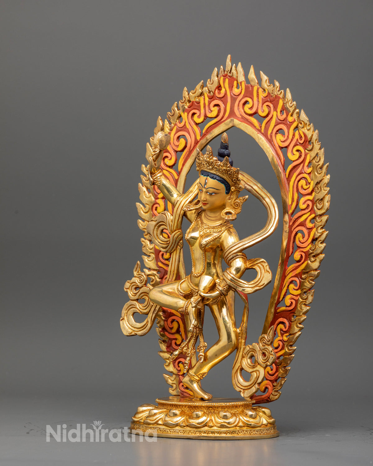 Machig labdron statue holding damaru and ritual bell in traditional chod iconography.