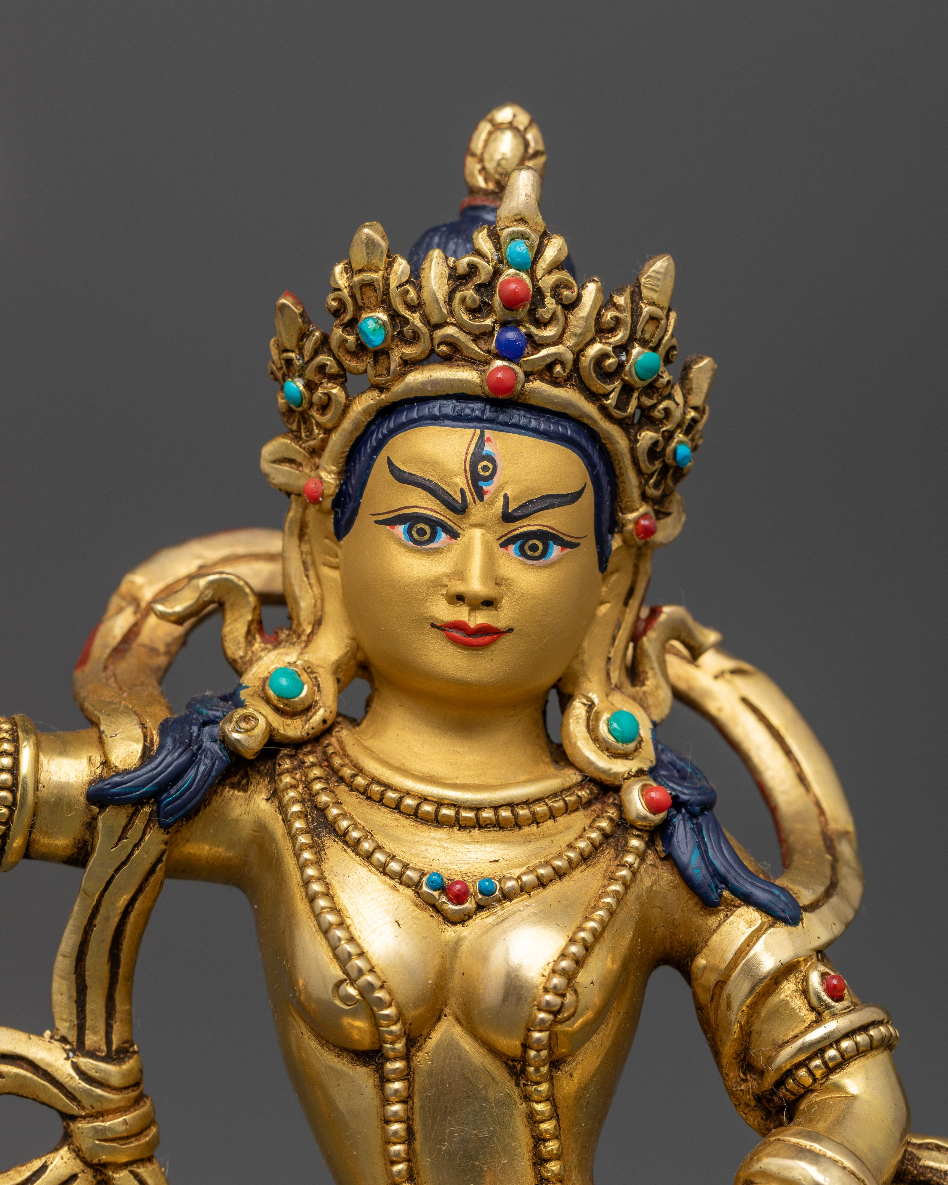 Machig Labdron statue with precious stone crown and layered necklaces.