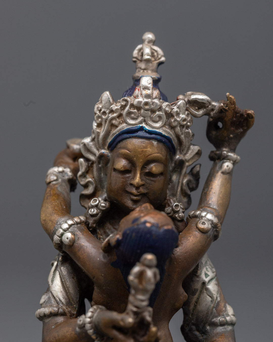 machine-made Vajrasattva Consort Statue seated on lotus throne with vajra in hand