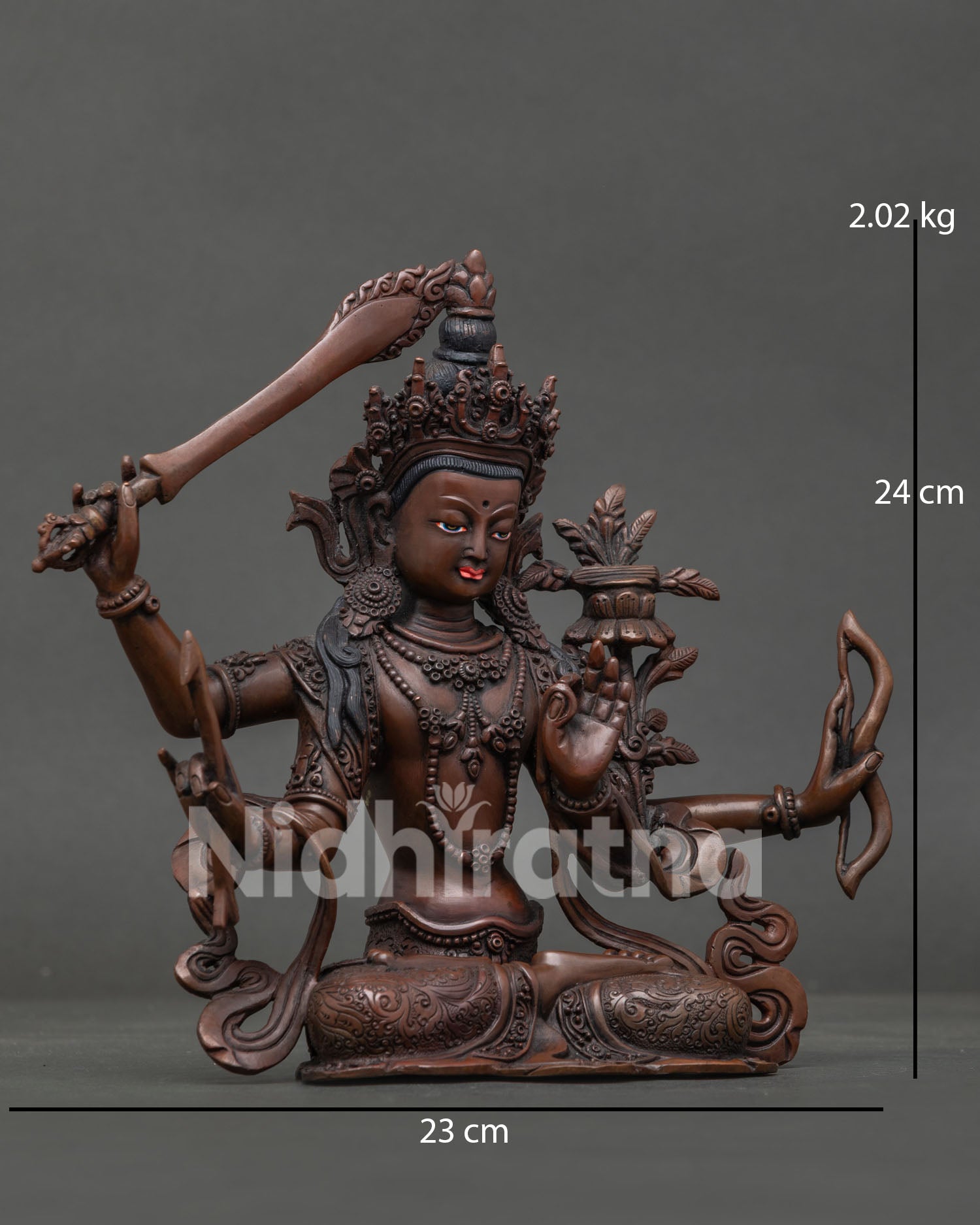 Maha Manjushri Buddhist sculpture with four arms holding sacred bow and arrow symbols