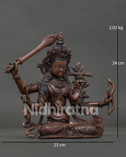Maha Manjushri Buddhist sculpture with four arms holding sacred bow and arrow symbols