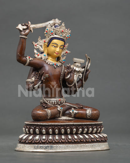Maha Manjushri statue four armed wisdom deity with flaming sword.