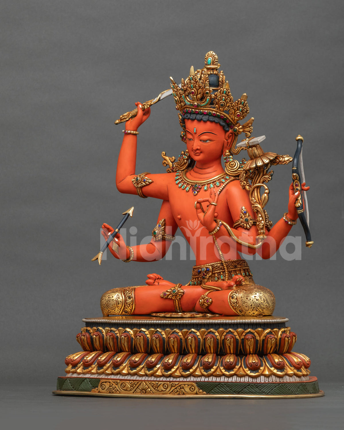 Maha Manjushri statue side profile with arrow, bow and flaming sword on a double-layered lotus seat