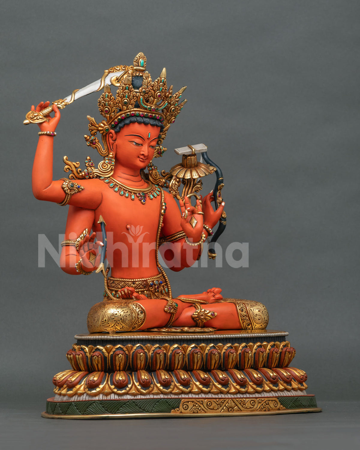 Maha Manjushri statue three-quarter view, four-armed Bodhisattva of Wisdom in gilded copper