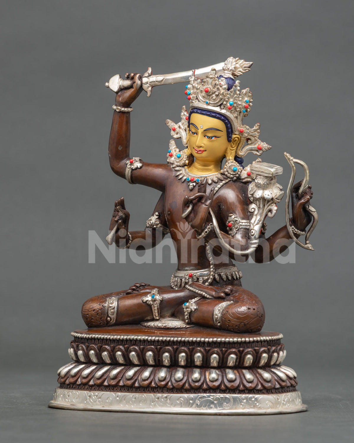 Maha Manjushri statue with Prajnaparamita Sutra bow and arrow.