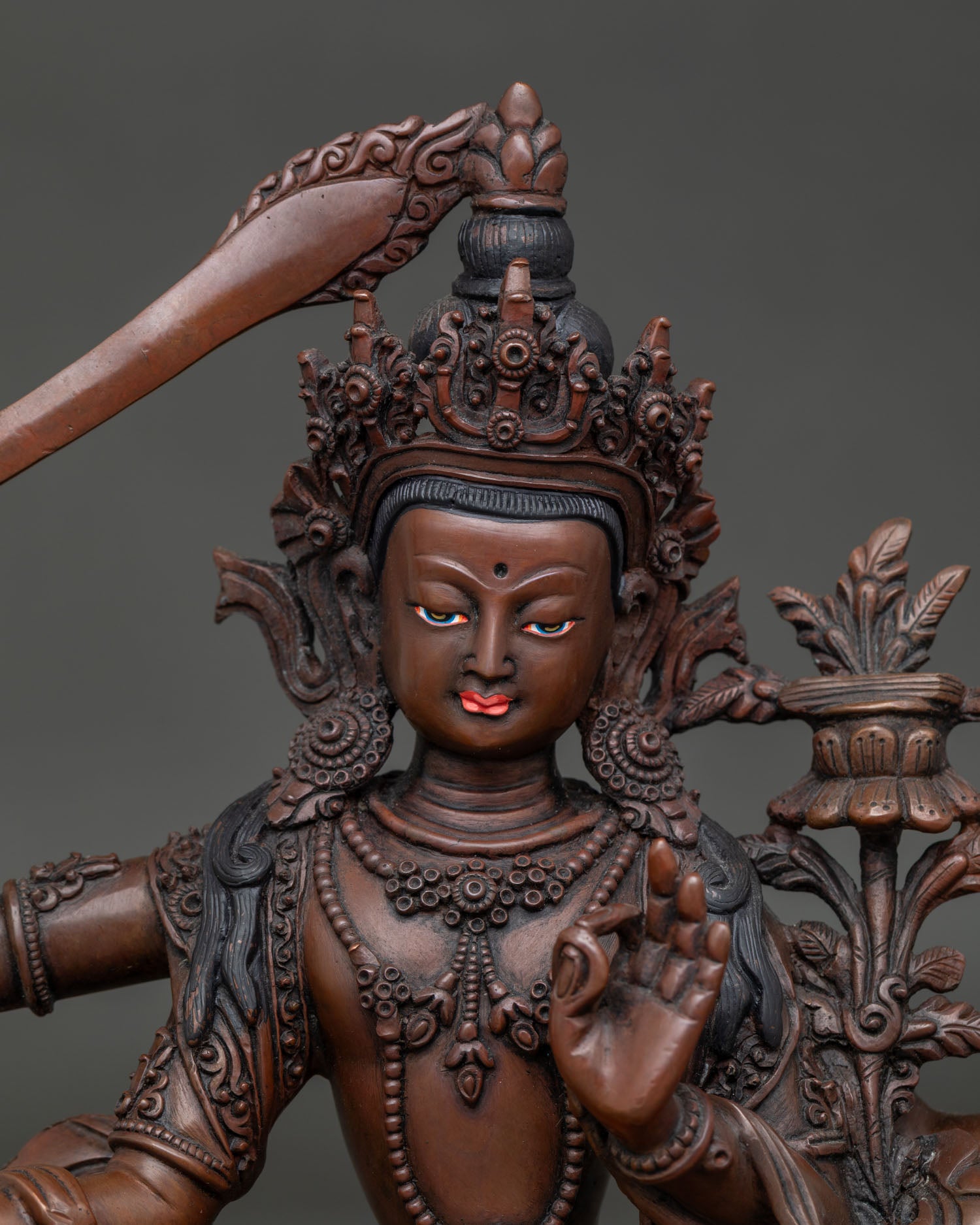 Maha Manjushri wisdom deity holding flaming sword and Prajnaparamita Sutra