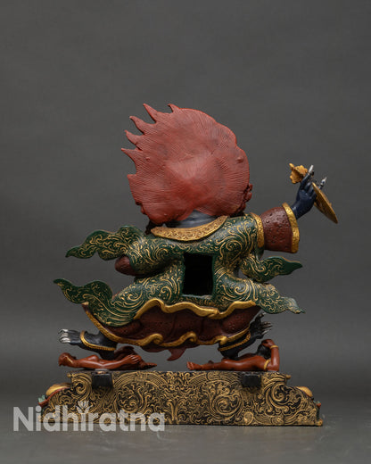 Back view of Mahakala Bernagchen statue revealing cloak texture and sculpted detailing