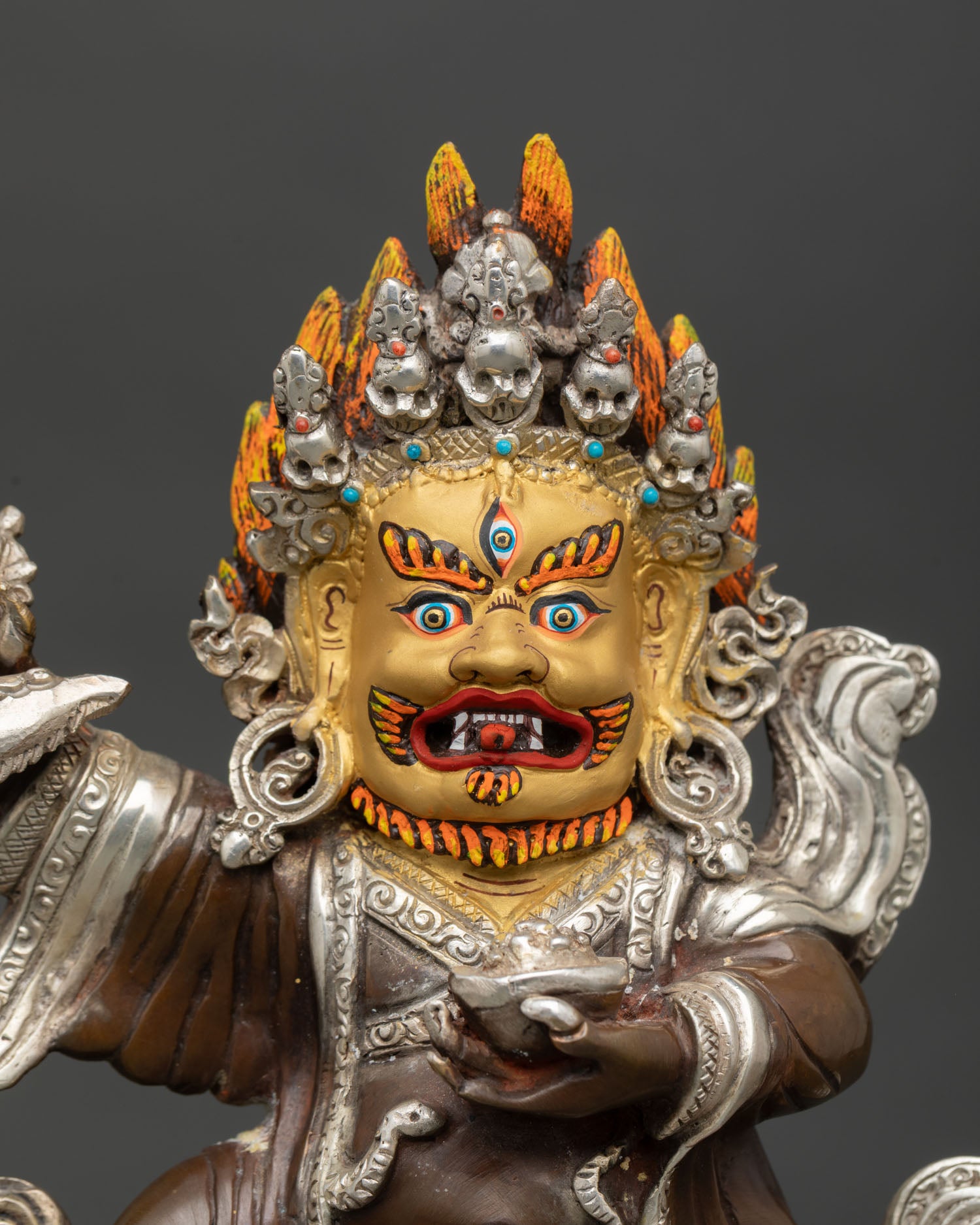 Mahakala Bernagchen statue close up view wrathful expression sacred Buddhist deity flaming halo Karma Kagyu guardian
