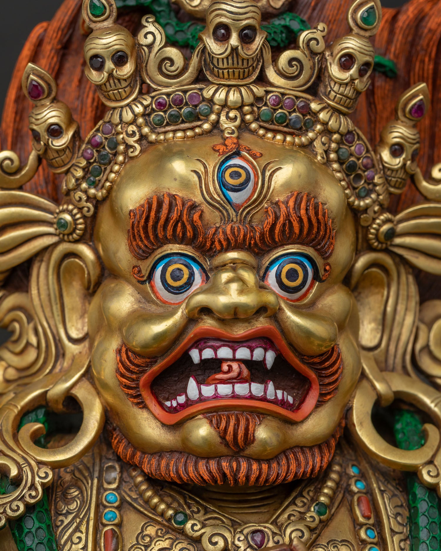 Mahakala Bernagchen wrathful face detail with fierce expression and gold finish