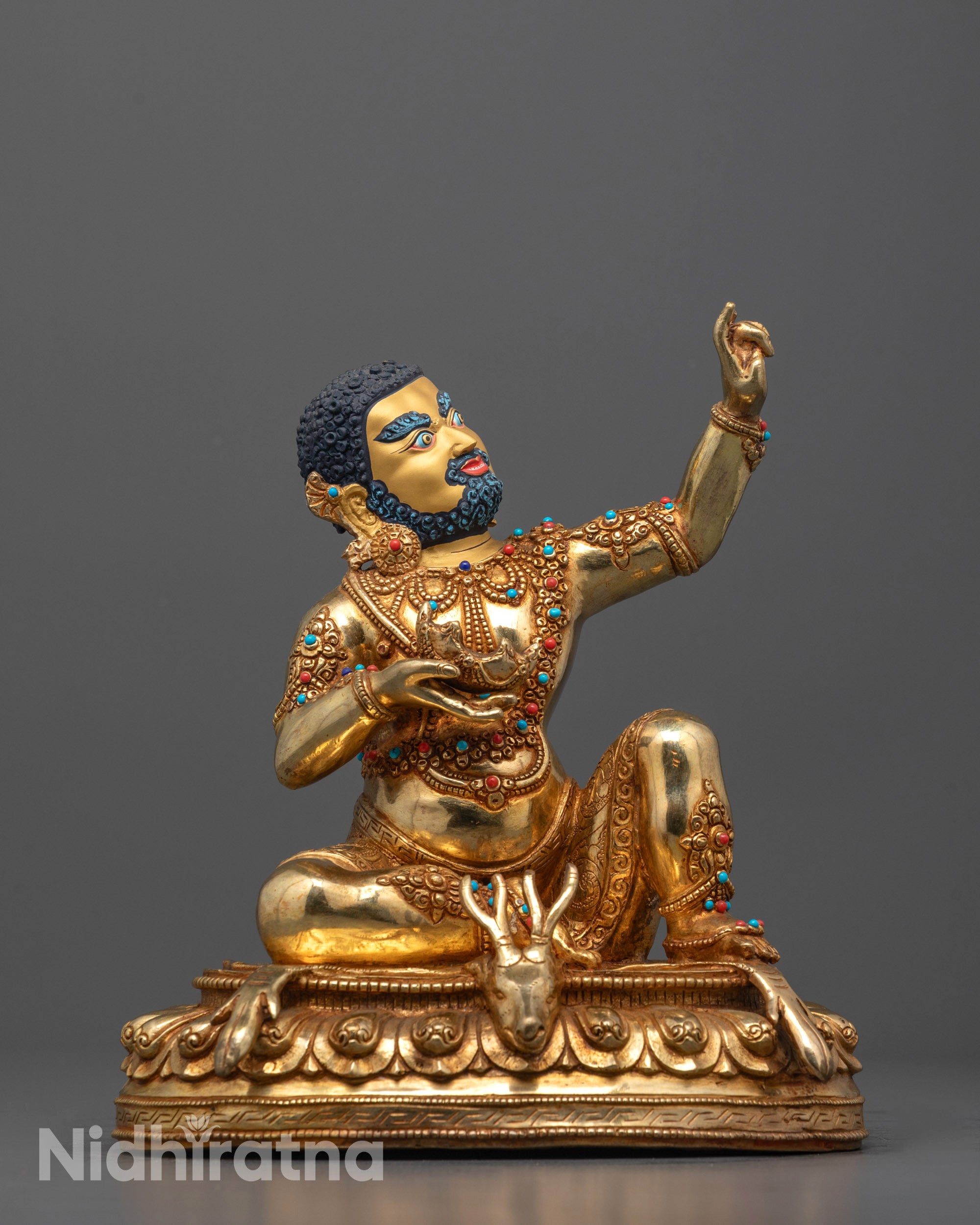 mahasiddha virupa statue front view with gold gilding and deer skin on lotus throne