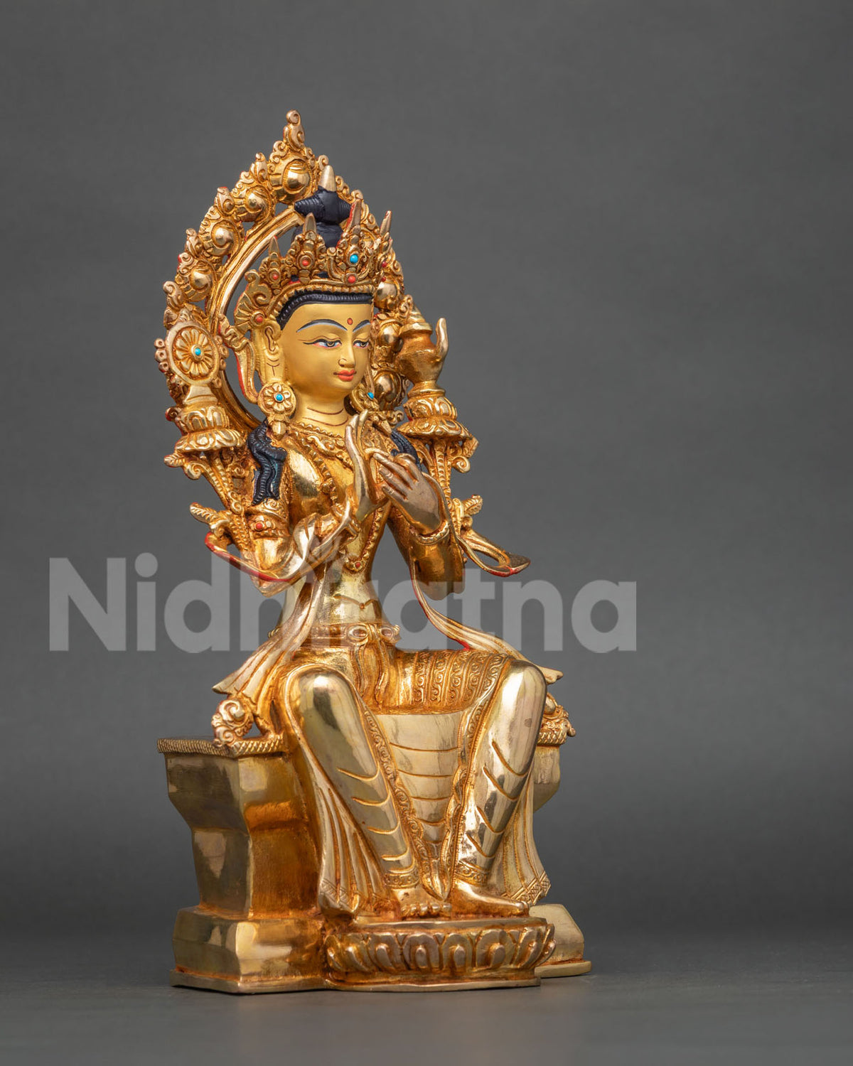Maitreya Buddha seated on ornate throne with lotus pedestal and carved halo