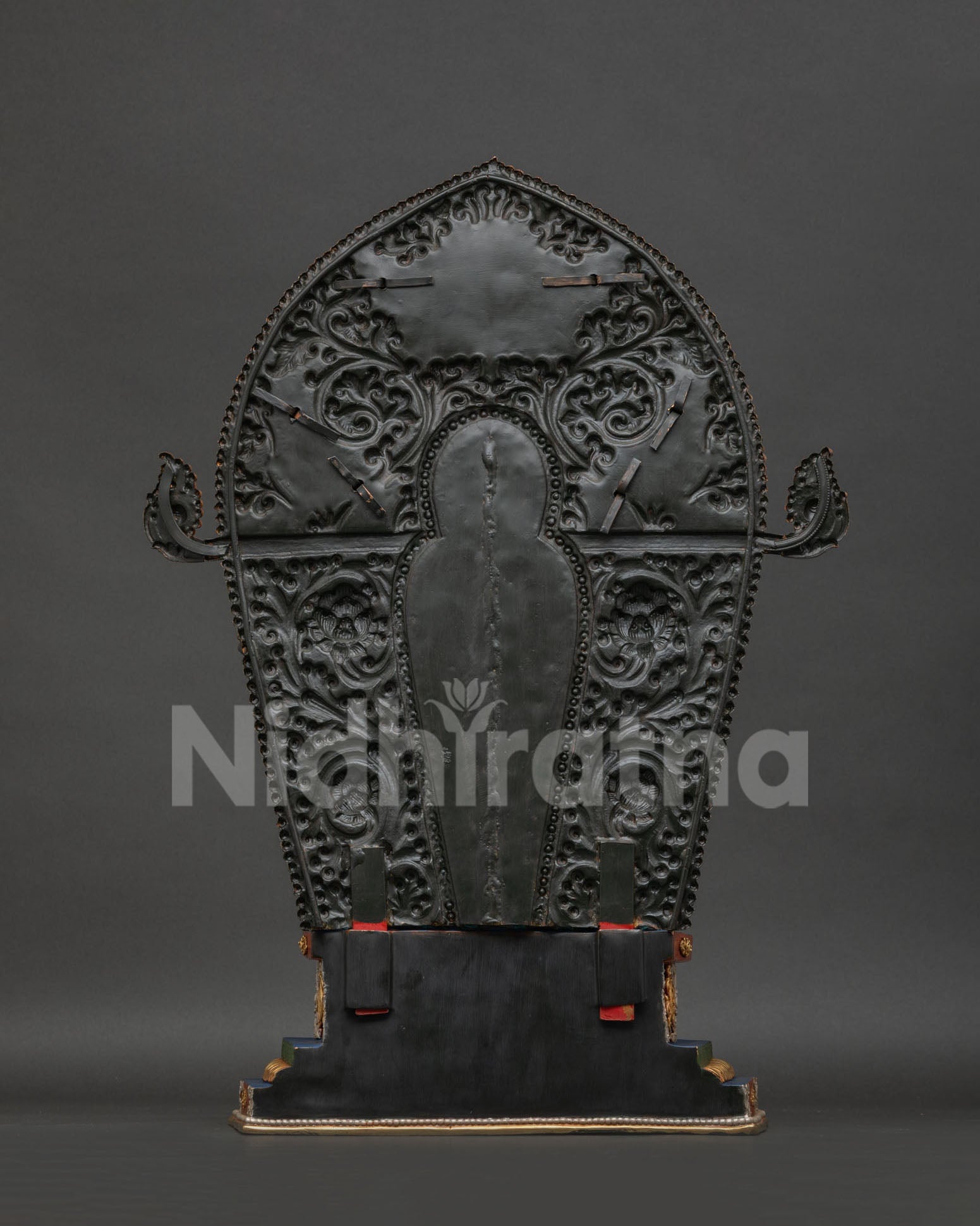 Maitreya Buddha statue back view showing copper sculpture and ornate halo