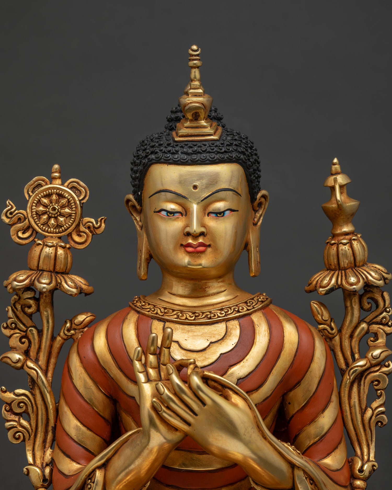 Maitreya Buddha statue front upper view showing serene face and stupa finial