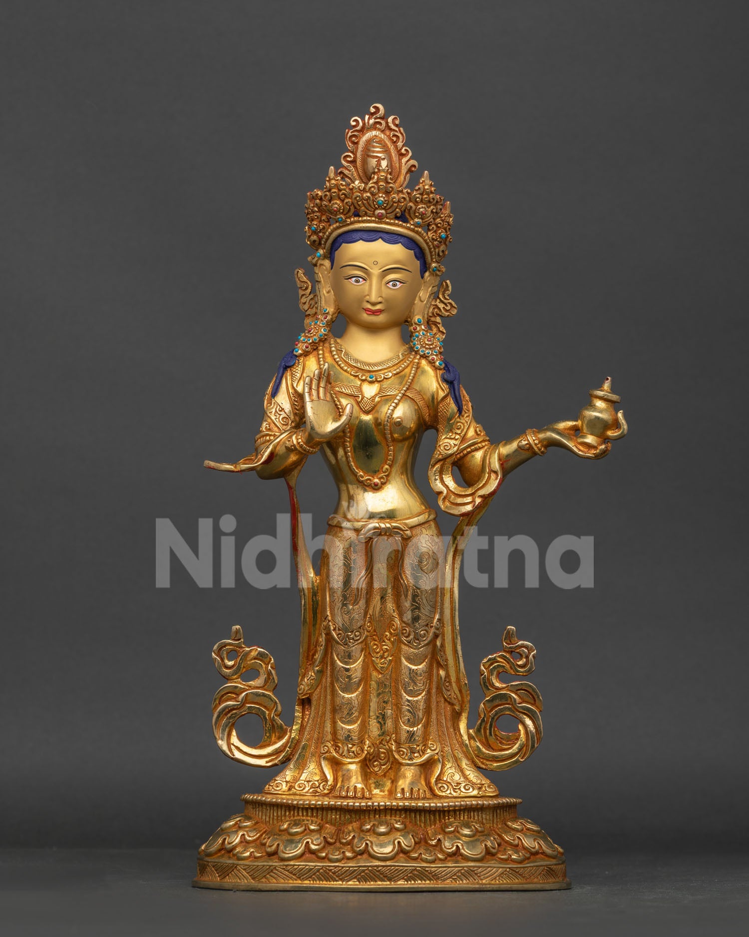 Mandarava statue in Indian attire holding a Kalash with raised Abhaya Mudra