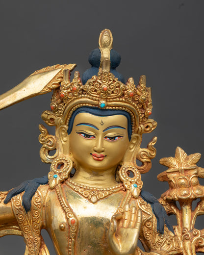 Manjushree face close up gold painted serene expression semi precious stone inlays