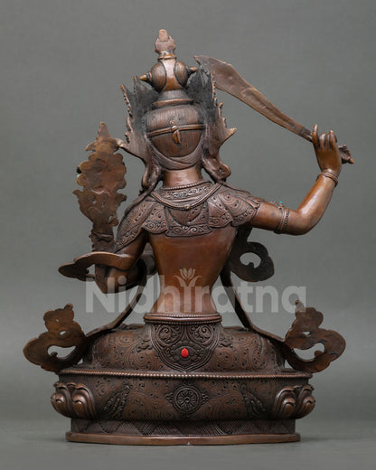 Detail of a handmade Manjushree statue base adorned with genuine coral stone on a lotus pedestal, Himalayan Buddhist art