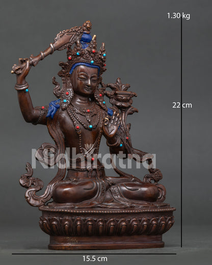 Manjushri Bodhisattva seated on lotus pedestal holding the flaming wisdom sword and Prajnaparamita Sutra