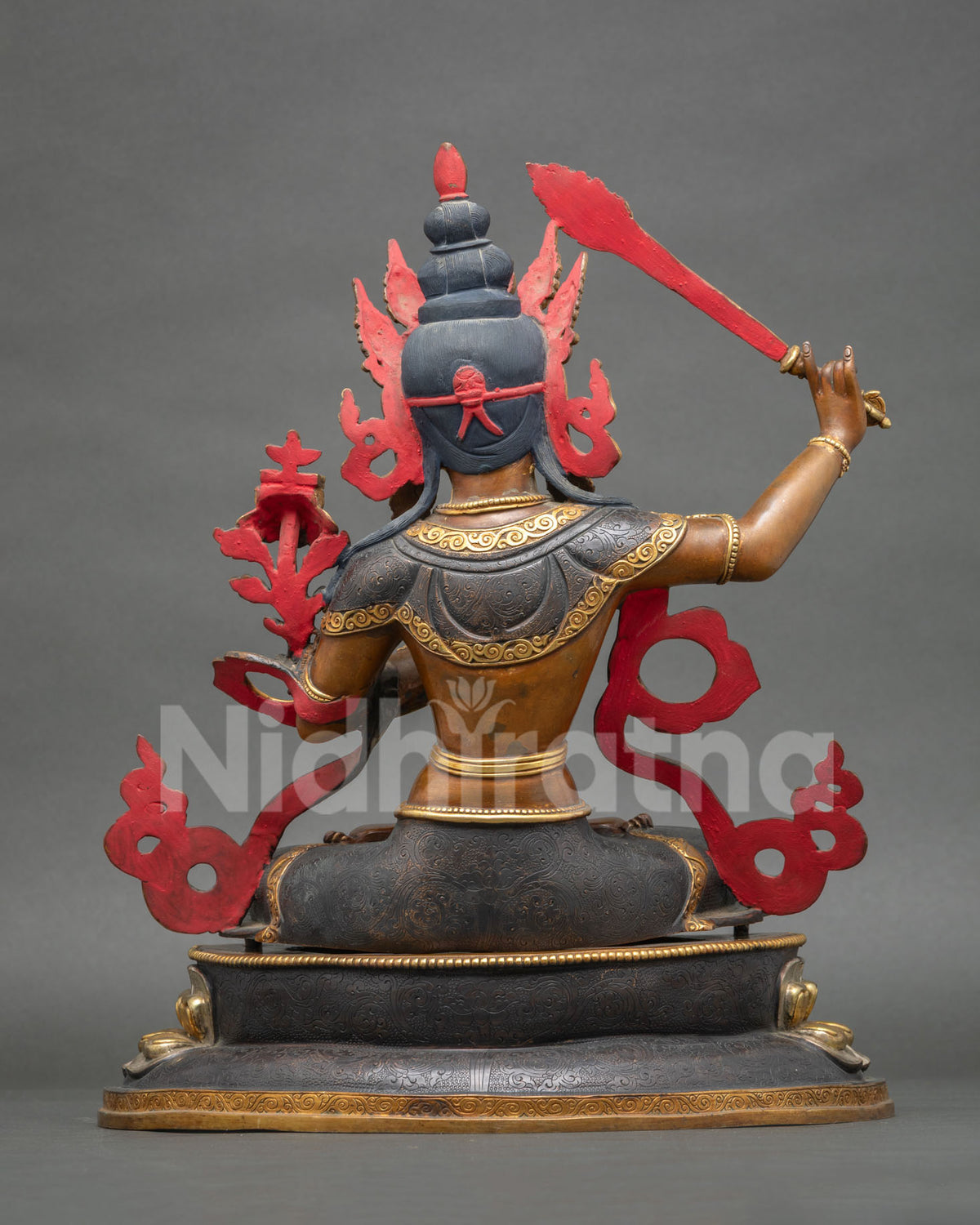 Manjushri Bodhisattva statue back view, oxidized copper with gold gilding, handmade in Nepal