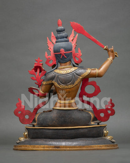 Manjushri Bodhisattva statue back view, oxidized copper with gold gilding, handmade in Nepal
