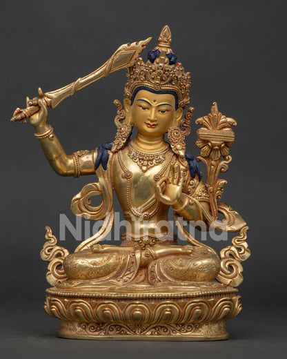 Manjushri Bodhisattva statue from Nepal in 24k gold gilded copper front view.