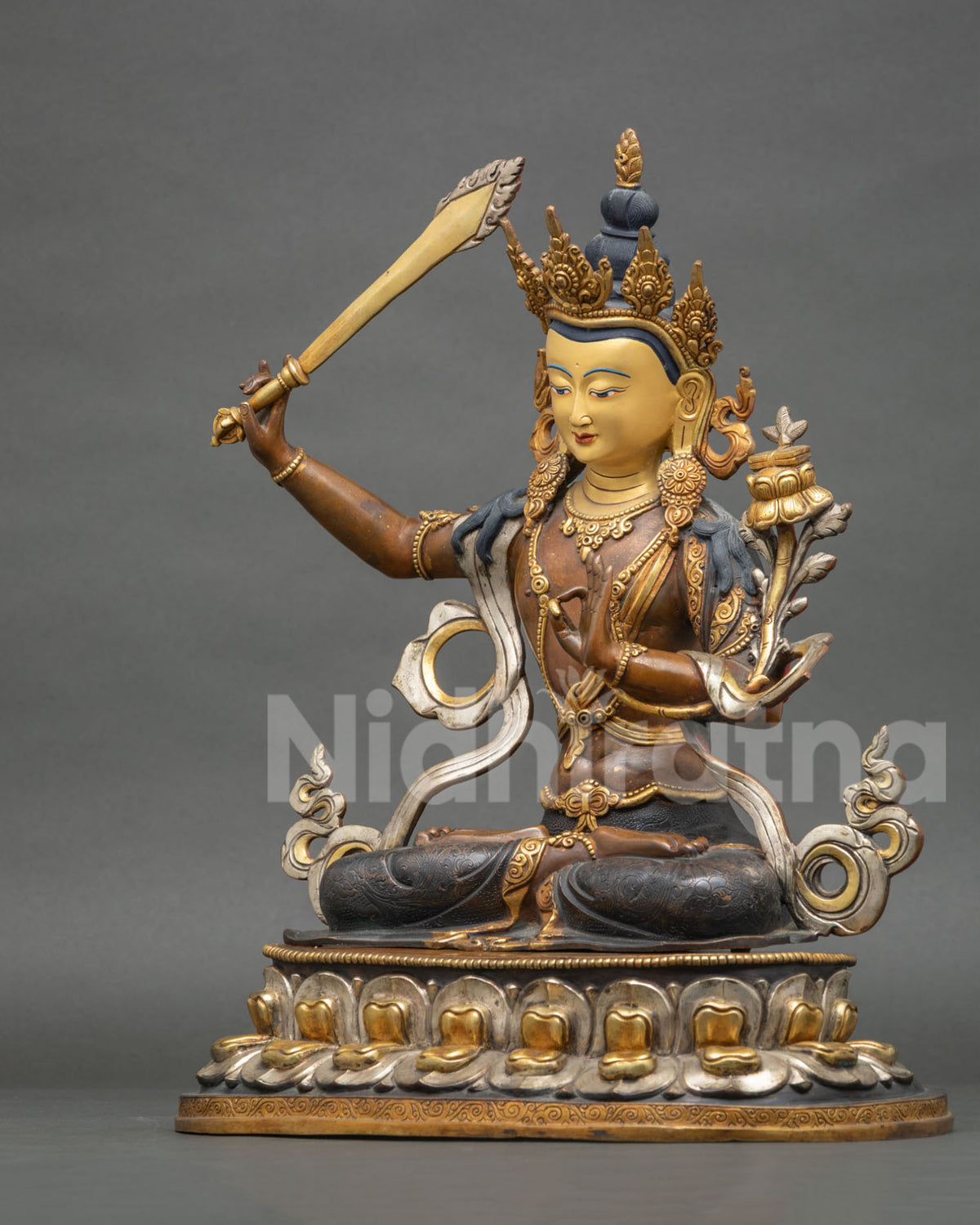 Manjushri Bodhisattva statue left side view with utpala flower and sutra, Nepal handmade