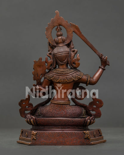 Manjushri Bodhisattva statue seated on lotus pedestal handcrafted Nepalese Buddhist art.