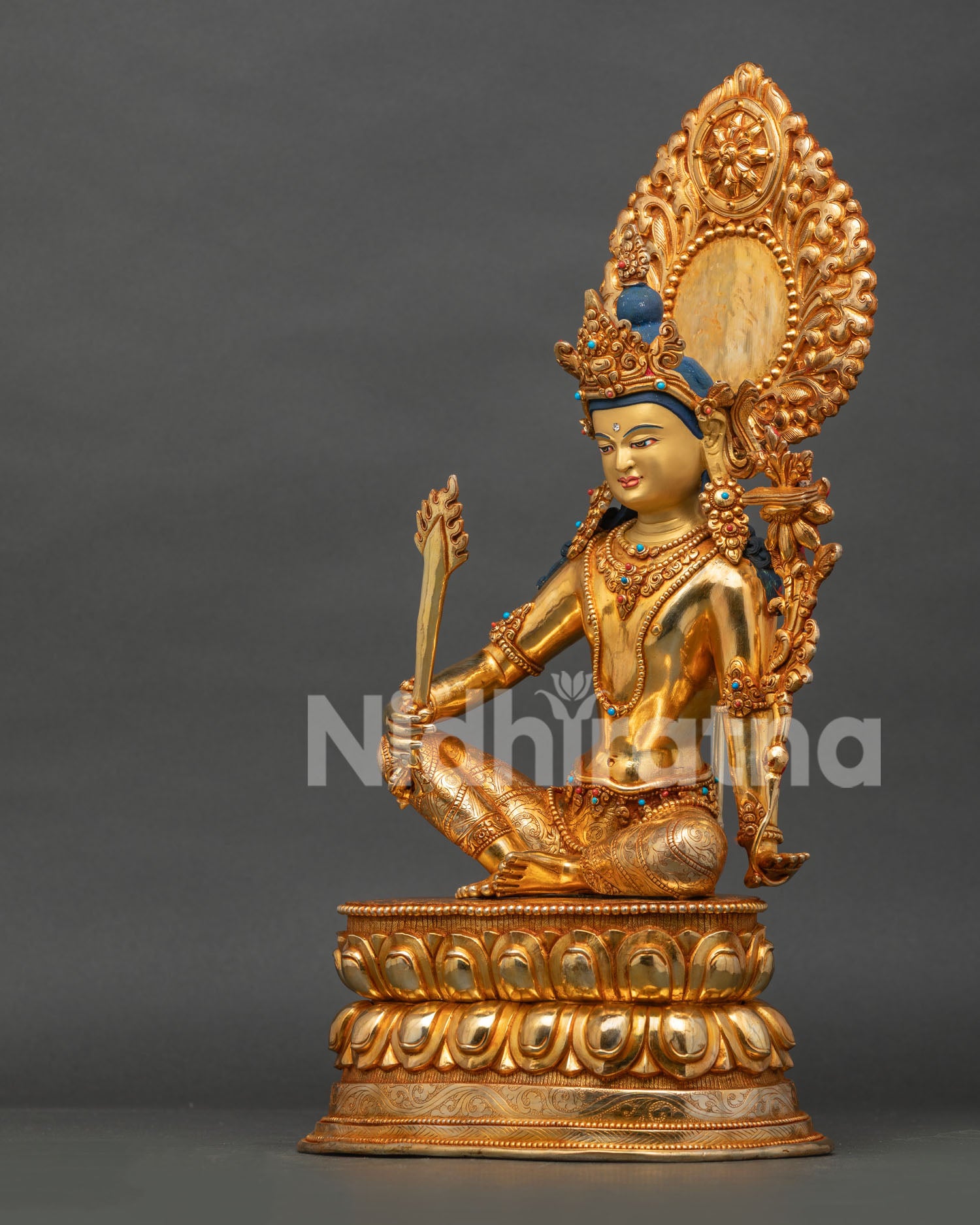 Manjushri Bodhisattva statue with flaming sword and Prajnaparamita scripture on lotus